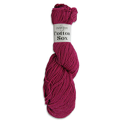 Pink yarn skein with a label on a white background cotton sox by cascade yarns